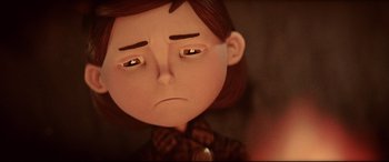 Movie still from “Krampus” (2015), directed by Michael Dougherty – A sad looking cartoon character; Close Up shot, Over the shoulder angle