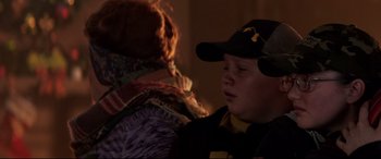Movie still from “Krampus” (2015), directed by Michael Dougherty – A young boy wearing a hat and a black jacket; Close Up shot, Over the shoulder angle