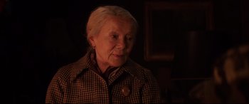 Movie still from “Krampus” (2015), directed by Michael Dougherty – An older woman wearing a checkered jacket; Close Up shot, Over the shoulder angle