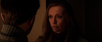 Movie still from “Krampus” (2015), directed by Michael Dougherty – A person looking at a mirror; Close Up shot, Over the shoulder angle