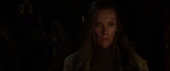 Movie still from “Krampus” (2015), directed by Michael Dougherty – A person with long brown hair; Close Up shot, Over the shoulder angle