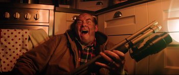 Movie still from “Krampus” (2015), directed by Michael Dougherty – A man holding a cell phone in his hands; Close Up shot, Low angle