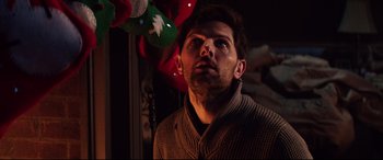 Movie still from “Krampus” (2015), directed by Michael Dougherty – A person wearing a sweater; Close Up shot, Low angle