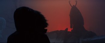 Movie still from “Krampus” (2015), directed by Michael Dougherty – A silhouette of an animal in a field at night; Wide shot, Low angle