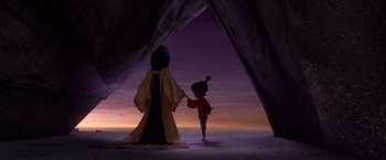 Movie still from “Kubo and the Two Strings” (2016), directed by Travis Knight – A scene from the animated film mulan with a character standing in front of a cave; Extreme Wide shot, Over the shoulder angle
