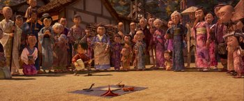 Movie still from “Kubo and the Two Strings” (2016), directed by Travis Knight – A group of people standing in front of a building; Wide shot, High angle