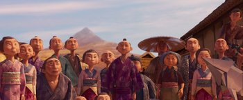Movie still from “Kubo and the Two Strings” (2016), directed by Travis Knight – A group of people standing next to each other in front of a mountain; Medium shot, Low angle