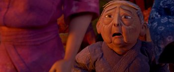 Movie still from “Kubo and the Two Strings” (2016), directed by Travis Knight – An old man's face in front of an older woman; Close Up shot, Low angle