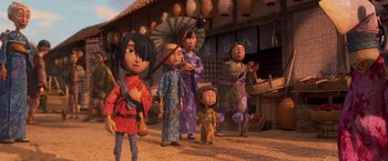 Movie still from “Kubo and the Two Strings” (2016), directed by Travis Knight – A group of people standing in front of a building; Wide shot, Low angle