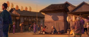 Movie still from “Kubo and the Two Strings” (2016), directed by Travis Knight – A group of people sitting on the side of a road; Extreme Wide shot, Low angle