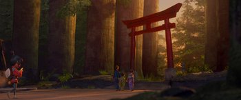 Movie still from “Kubo and the Two Strings” (2016), directed by Travis Knight – A couple of people standing next to each other in a forest; Extreme Wide shot, Low angle