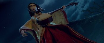 Movie still from “Kubo and the Two Strings” (2016), directed by Travis Knight – A statue of a woman holding a banjo in front of a cloudy sky; Medium shot, Low angle