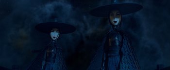 Movie still from “Kubo and the Two Strings” (2016), directed by Travis Knight – A couple of women wearing hats standing next to each other; Close Up shot, Low angle