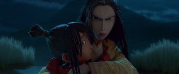 Movie still from “Kubo and the Two Strings” (2016), directed by Travis Knight – A woman holding a child in her arms in a scene; Close Up shot, Low angle