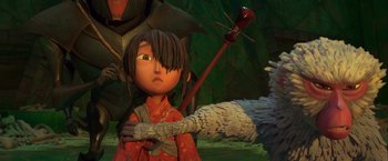 Movie still from “Kubo and the Two Strings” (2016), directed by Travis Knight – A girl in a red kimono is holding a bird; Medium shot, Low angle