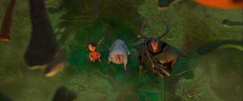 Movie still from “Kubo and the Two Strings” (2016), directed by Travis Knight – A group of characters from the animated film where they are standing on some leaves; Wide shot, Overhead angle