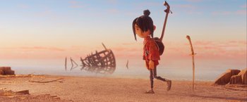 Movie still from “Kubo and the Two Strings” (2016), directed by Travis Knight – A girl walking on the beach near a wrecked ship; Wide shot, Low angle