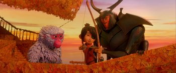 Movie still from “Kubo and the Two Strings” (2016), directed by Travis Knight – A group of people standing next to each other on top of a hill; Wide shot, Over the shoulder angle