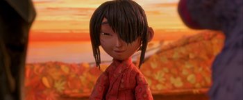 Movie still from “Kubo and the Two Strings” (2016), directed by Travis Knight – A doll's face in front of an autumn background; Close Up shot, Low angle