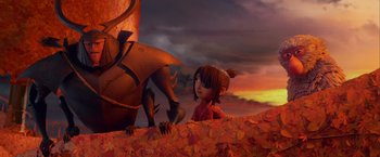 Movie still from “Kubo and the Two Strings” (2016), directed by Travis Knight – A girl and a dragon in a field of autumn leaves; Medium shot, Over the shoulder angle
