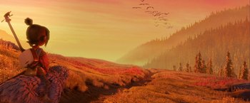 Movie still from “Kubo and the Two Strings” (2016), directed by Travis Knight – A flock of birds flying over a lush green field; Extreme Wide shot, High angle