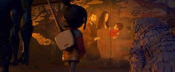 Movie still from “Kubo and the Two Strings” (2016), directed by Travis Knight – A woman standing in front of a painting of a man and a child; Medium shot, Over the shoulder angle