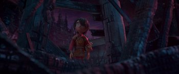 Movie still from “Kubo and the Two Strings” (2016), directed by Travis Knight – A toy character is standing in front of a wooden structure; Wide shot, Low angle