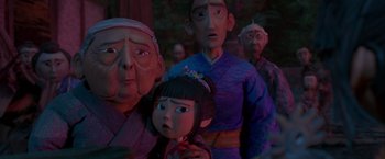Movie still from “Kubo and the Two Strings” (2016), directed by Travis Knight – A group of people standing next to each other; Close Up shot, Over the shoulder angle