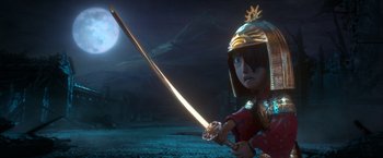 Movie still from “Kubo and the Two Strings” (2016), directed by Travis Knight – A person in a helmet is holding a sword; Medium shot, Low angle