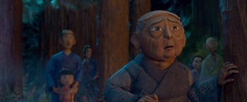 Movie still from “Kubo and the Two Strings” (2016), directed by Travis Knight – A man in a blue sweater and a hat is in the woods; Close Up shot, Low angle