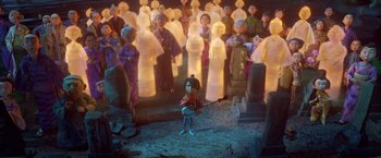 Movie still from “Kubo and the Two Strings” (2016), directed by Travis Knight – A group of people standing in front of a statue; Wide shot, Over the shoulder angle