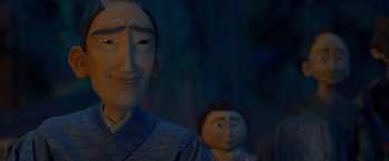 Movie still from “Kubo and the Two Strings” (2016), directed by Travis Knight – Two wooden statues of a man and a woman; Close Up shot, Low angle