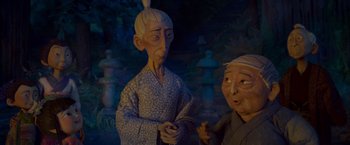 Movie still from “Kubo and the Two Strings” (2016), directed by Travis Knight – A couple of people standing next to each other; Close Up shot, Over the shoulder angle
