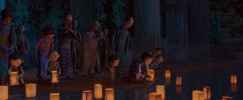 Movie still from “Kubo and the Two Strings” (2016), directed by Travis Knight – A group of people gathered around a pond at night; Wide shot, High angle