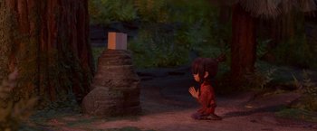 Movie still from “Kubo and the Two Strings” (2016), directed by Travis Knight – A little girl standing in front of a stone structure; Wide shot, High angle