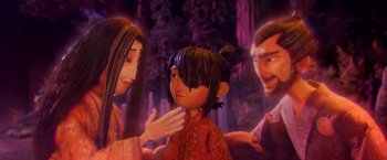 Movie still from “Kubo and the Two Strings” (2016), directed by Travis Knight – A woman and two men are looking at a little girl; Medium shot, Over the shoulder angle