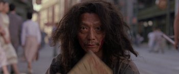 A man with long black hair and a beard