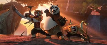 Movie still from “Kung Fu Panda 2” (2011), directed by Jennifer Yuh Nelson – A group of animals that are standing in the dirt; Wide shot, Low angle