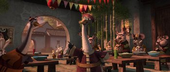 Movie still from “Kung Fu Panda 2” (2011), directed by Jennifer Yuh Nelson – An animated scene of a bird and some other animals in a courtyard; Medium shot, Over the shoulder angle