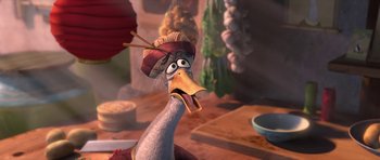 Movie still from “Kung Fu Panda 2” (2011), directed by Jennifer Yuh Nelson – An animated bird with a hat on his head; Close Up shot, High angle