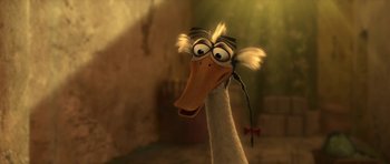 Movie still from “Kung Fu Panda 2” (2011), directed by Jennifer Yuh Nelson – A duck wearing a pair of glasses and a bow tie; Close Up shot, High angle