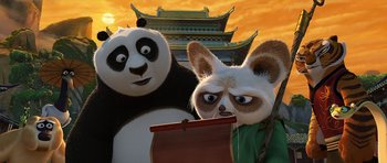 Movie still from “Kung Fu Panda 2” (2011), directed by Jennifer Yuh Nelson – A couple of panda bears standing next to each other in front of a building; Close Up shot, Low angle