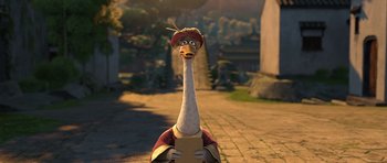 Movie still from “Kung Fu Panda 2” (2011), directed by Jennifer Yuh Nelson – An animated bird with a hat on his head; Close Up shot, High angle