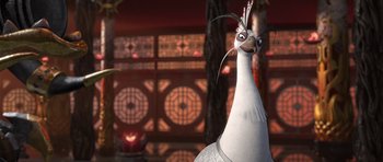 Movie still from “Kung Fu Panda 2” (2011), directed by Jennifer Yuh Nelson – A white bird is standing in front of a building; Close Up shot, Over the shoulder angle
