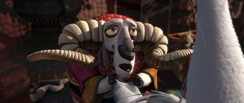 Movie still from “Kung Fu Panda 2” (2011), directed by Jennifer Yuh Nelson – An animated sheep with horns is sitting on top of a vehicle; Close Up shot, Over the shoulder angle