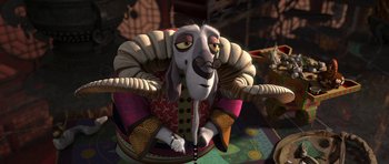 Movie still from “Kung Fu Panda 2” (2011), directed by Jennifer Yuh Nelson – A dog sitting in a chair in a living room; Medium shot, High angle