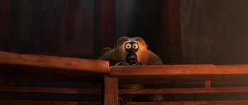 Movie still from “Kung Fu Panda 2” (2011), directed by Jennifer Yuh Nelson – An animated bear looking over a railing; Close Up shot, High angle