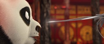 Movie still from “Kung Fu Panda 2” (2011), directed by Jennifer Yuh Nelson – A dog with a knife in its mouth; Close Up shot, Over the shoulder angle