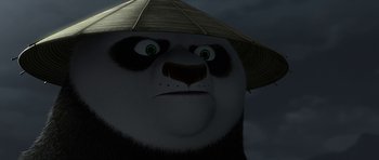 Movie still from “Kung Fu Panda 2” (2011), directed by Jennifer Yuh Nelson – A panda bear wearing a hat; Close Up shot, Low angle