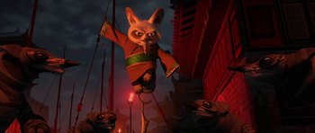 Movie still from “Kung Fu Panda 2” (2011), directed by Jennifer Yuh Nelson – An animated rabbit is hanging from a pole; Wide shot, Low angle